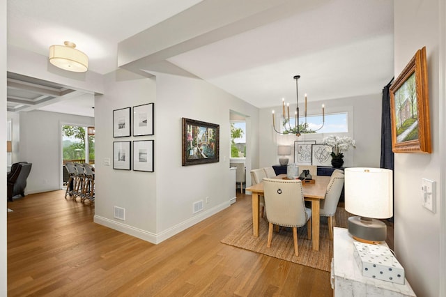 6100 151st St, Savage, MN 55378 - dining area featuring light wood-style flooring, plenty of natural light, a chandelier, and baseboards