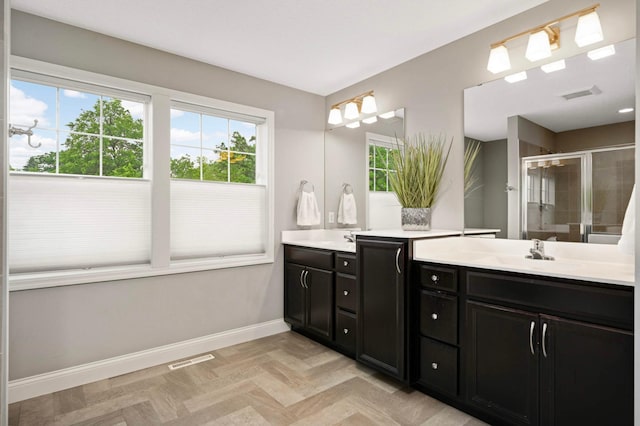 6100 151st St, Savage, MN 55378 - bathroom featuring a shower stall, vanity, and baseboards