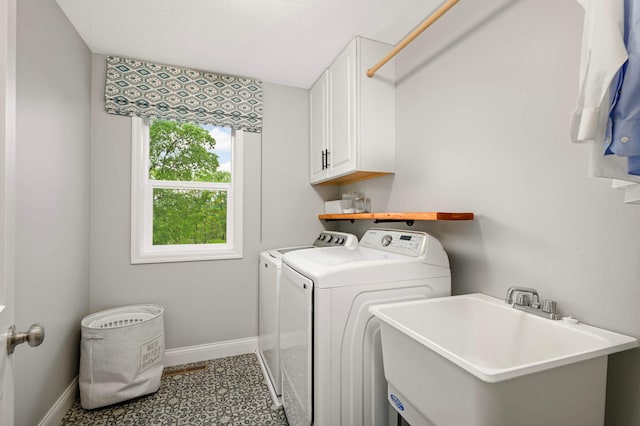 6100 151st St, Savage, MN 55378 - washroom with separate washer and dryer, cabinet space, and baseboards