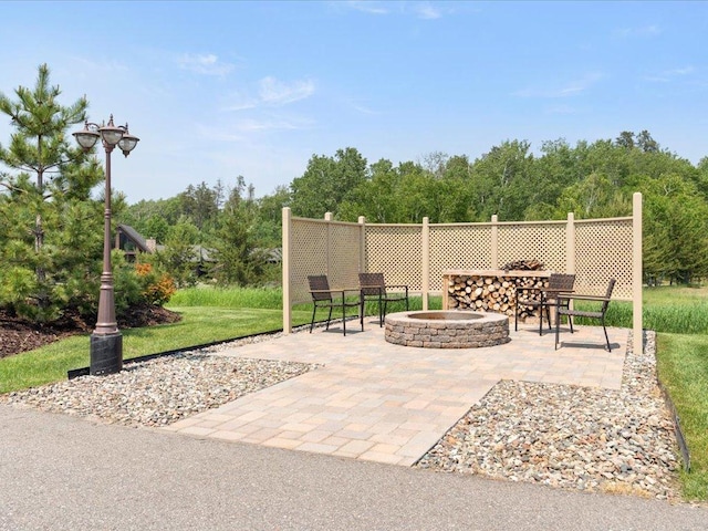 7496 Fairway Ln, Breezy Point, MN 56472 - view of patio / terrace with an outdoor fire pit