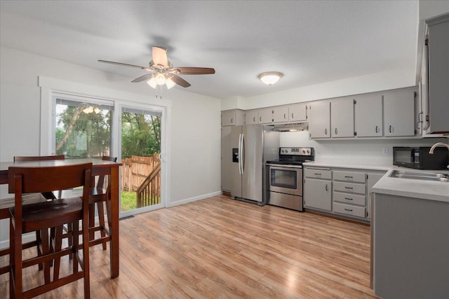 751 Sand Hill Pt, North Hudson, WI 54016 - kitchen featuring appliances with stainless steel finishes, gray cabinetry, and a sink