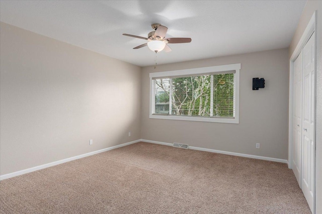751 Sand Hill Pt, North Hudson, WI 54016 - unfurnished bedroom with carpet flooring, a closet, baseboards, and ceiling fan