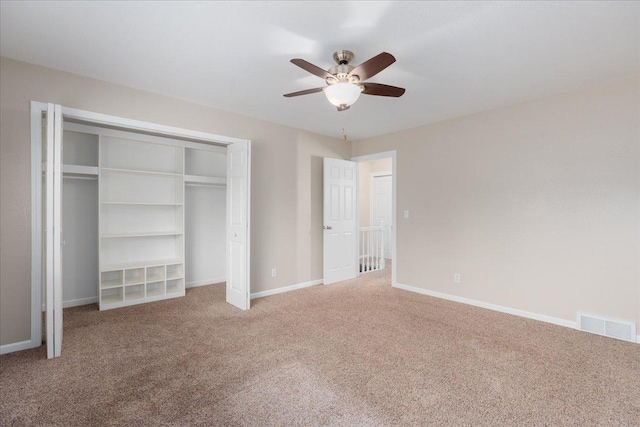 751 Sand Hill Pt, North Hudson, WI 54016 - unfurnished bedroom with carpet, baseboards, ceiling fan, and a closet