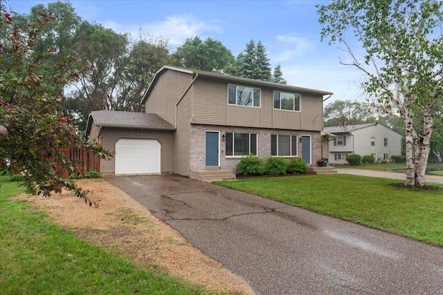 751 Sand Hill Pt, North Hudson, WI 54016 - colonial house with an attached garage, driveway, and brick siding
