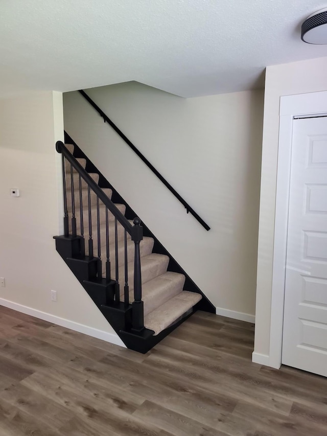 751 Sand Hill Pt, North Hudson, WI 54016 - stairway with baseboards and wood finished floors