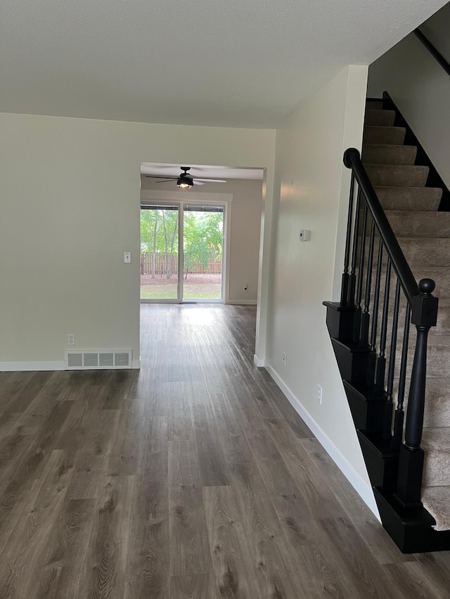 751 Sand Hill Pt, North Hudson, WI 54016 - hall featuring dark wood-style flooring, baseboards, and stairway