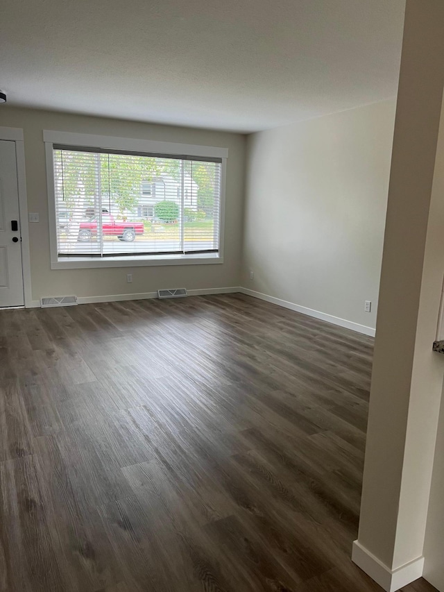 751 Sand Hill Pt, North Hudson, WI 54016 - unfurnished room with dark wood-style floors and baseboards