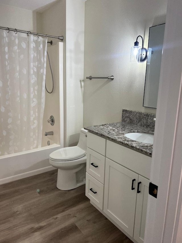 751 Sand Hill Pt, North Hudson, WI 54016 - bathroom featuring wood finished floors, vanity, shower / bathtub combination with curtain, and toilet
