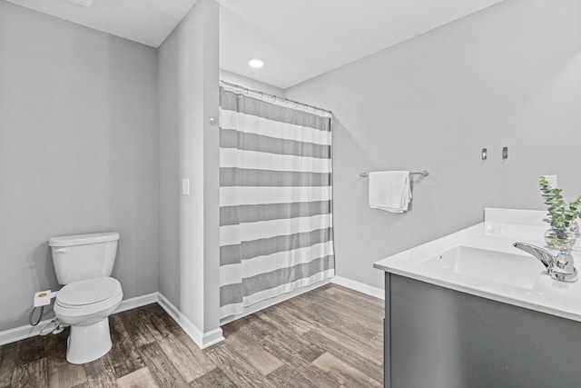 8756 Granite Ln, Woodbury, MN 55129 - bathroom featuring wood finished floors, baseboards, and toilet