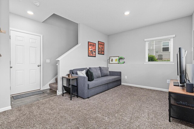 8756 Granite Ln, Woodbury, MN 55129 - carpeted living area featuring baseboards, stairway, and recessed lighting