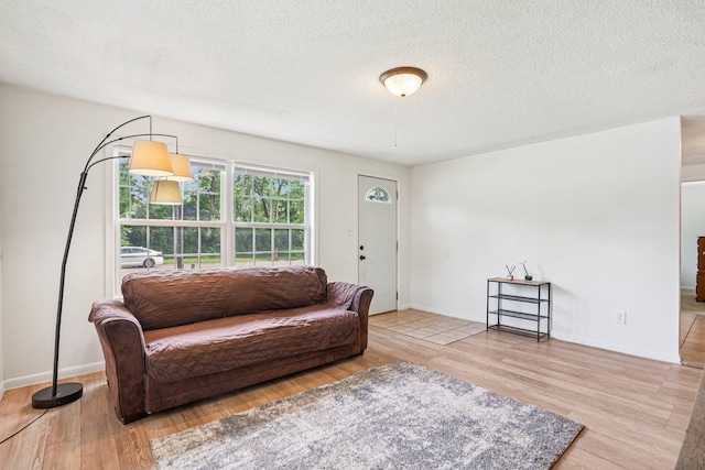 1524 Arlington Ave E, Saint Paul, MN 55106 - living room featuring wood finished floors and a textured ceiling