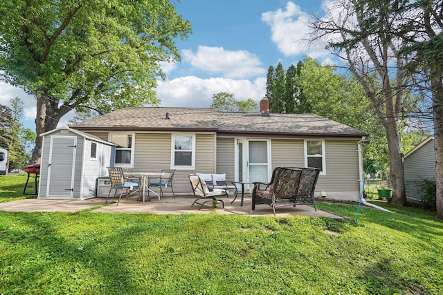 1524 Arlington Ave E, Saint Paul, MN 55106 - back of house with a storage shed, a patio, a lawn, and a chimney