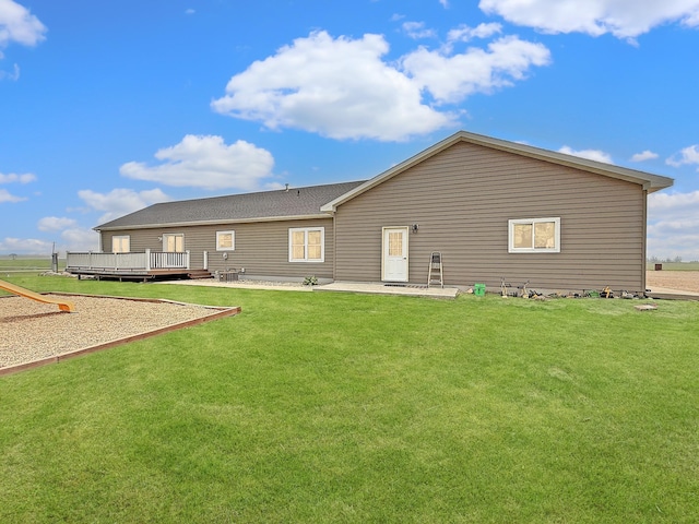 2771 271st Ave, Madison, MN 56256 - rear view of house featuring a deck, a yard, and a patio