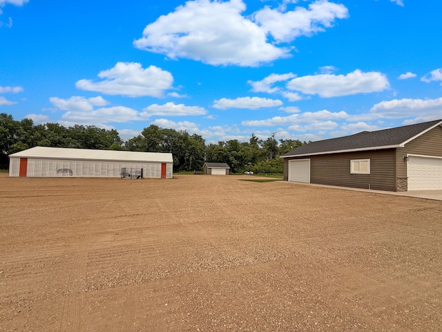 2771 271st Ave, Madison, MN 56256 - view of yard with an outbuilding and a detached garage