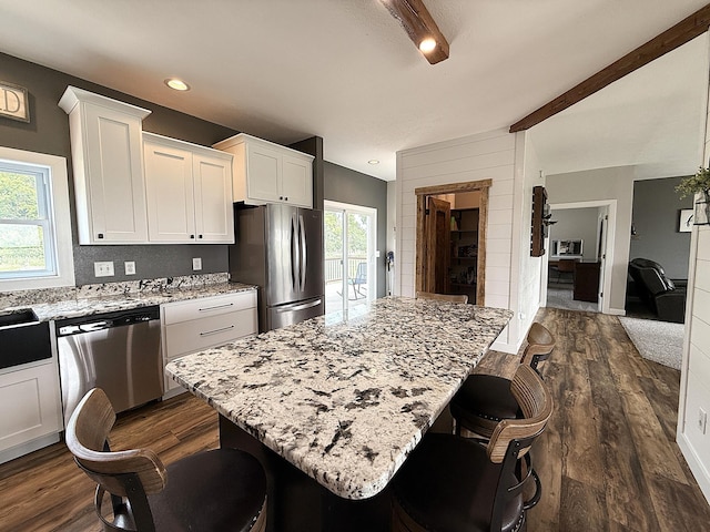 2771 271st Ave, Madison, MN 56256 - kitchen with stainless steel appliances, plenty of natural light, light stone counters, white cabinets, and recessed lighting