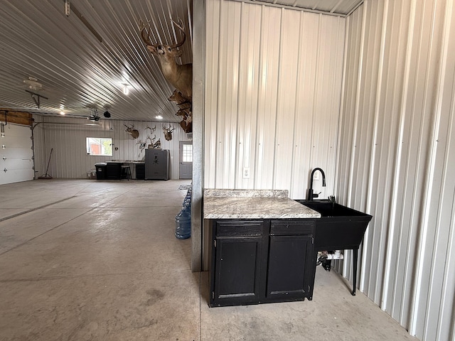 2771 271st Ave, Madison, MN 56256 - garage featuring a sink and a garage door opener
