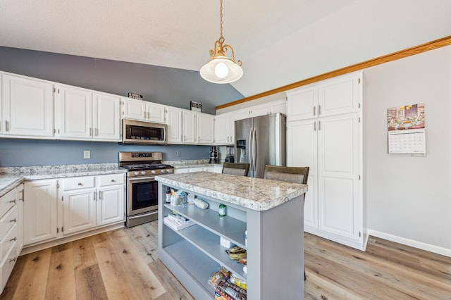 10344 Fox Run Rd, Woodbury, MN 55129 - kitchen featuring stainless steel appliances, lofted ceiling, white cabinets, light wood-style floors, and hanging light fixtures