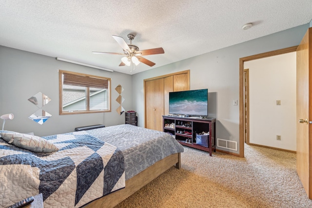 10344 Fox Run Rd, Woodbury, MN 55129 - bedroom with light colored carpet, a closet, ceiling fan, baseboards, and a textured ceiling