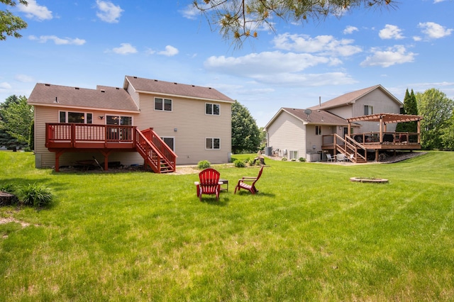 10344 Fox Run Rd, Woodbury, MN 55129 - back of property featuring a pergola, a wooden deck, stairs, and a lawn