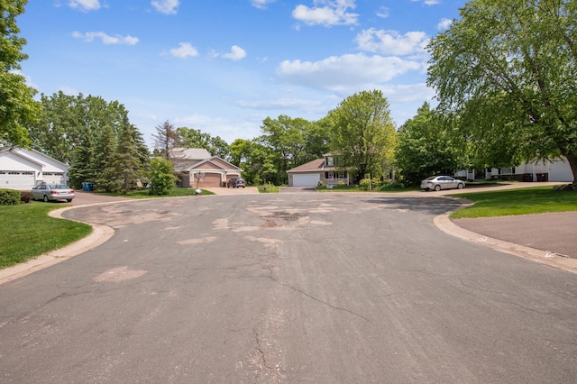 10344 Fox Run Rd, Woodbury, MN 55129 - view of asphalt street with curbs and a residential view