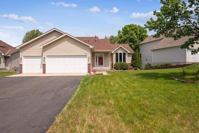 10344 Fox Run Rd, Woodbury, MN 55129 - ranch-style house featuring an attached garage, driveway, a front lawn, brick siding, and cooling unit