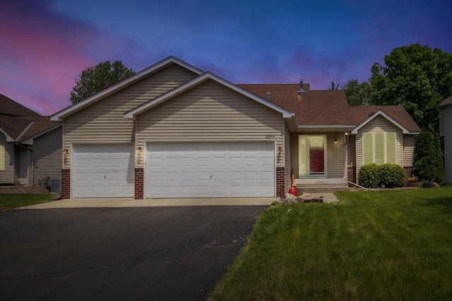 10344 Fox Run Rd, Woodbury, MN 55129 - ranch-style house featuring driveway, an attached garage, brick siding, and a lawn