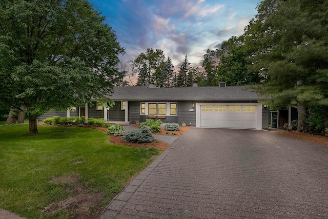 406 Kenmar Cir, Minnetonka, MN 55305 - ranch-style home with driveway, an attached garage, and a front yard