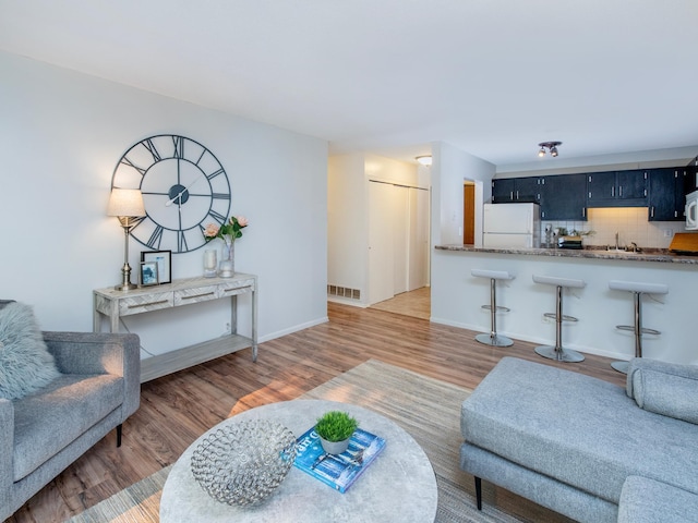 4010 52nd St Unit 204, Minneapolis, MN 55417 - living room with wood finished floors and baseboards