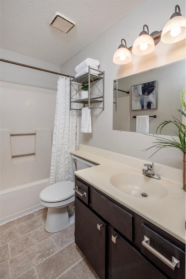 4010 52nd St Unit 204, Minneapolis, MN 55417 - full bath with vanity, toilet, stone tile flooring, a textured ceiling, and shower / bath combo with shower curtain