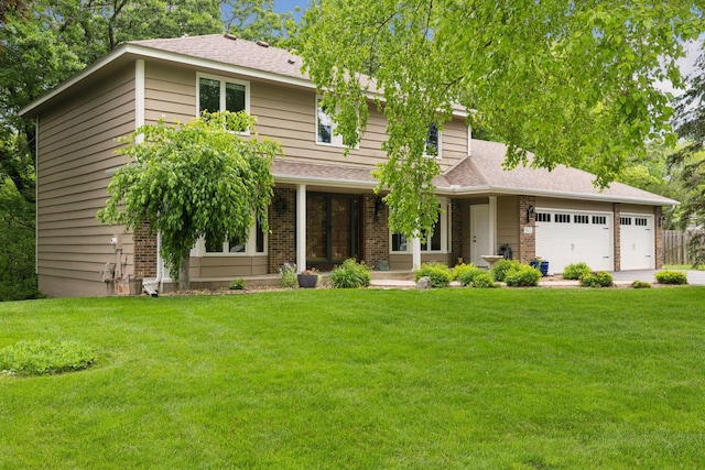 5921 Creek Pt, Minnetonka, MN 55345 - view of front facade featuring a front yard, a garage, concrete driveway, and brick siding