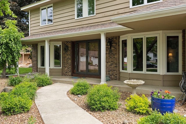 5921 Creek Pt, Minnetonka, MN 55345 - property entrance featuring brick siding and a shingled roof