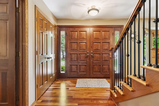 5921 Creek Pt, Minnetonka, MN 55345 - entrance foyer with light wood-style floors and stairs
