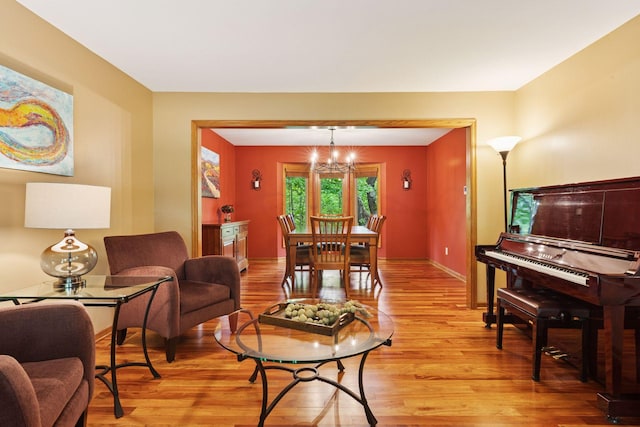 5921 Creek Pt, Minnetonka, MN 55345 - living area with light wood-style floors, a chandelier, and baseboards