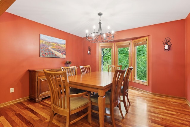 5921 Creek Pt, Minnetonka, MN 55345 - dining area featuring a chandelier, baseboards, and light wood-style flooring
