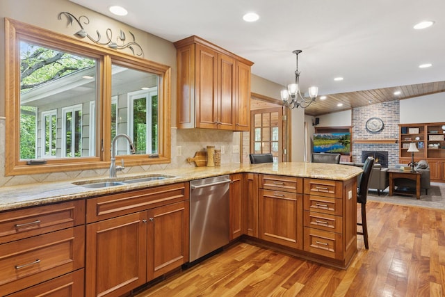 5921 Creek Pt, Minnetonka, MN 55345 - kitchen with a sink, stainless steel dishwasher, open floor plan, light wood-type flooring, and a peninsula