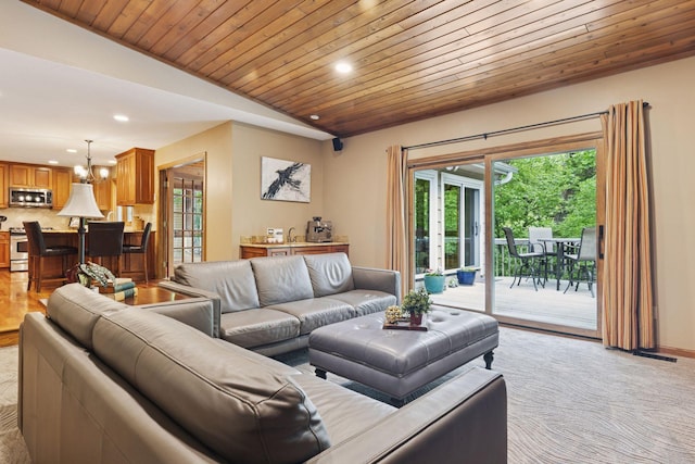 5921 Creek Pt, Minnetonka, MN 55345 - living room featuring recessed lighting, vaulted ceiling, wood ceiling, light colored carpet, and a chandelier