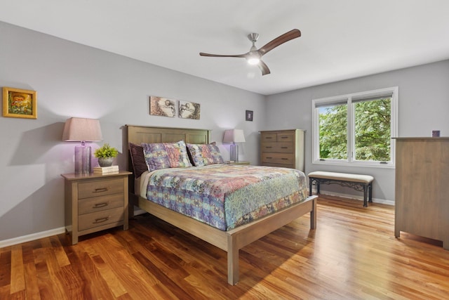 5921 Creek Pt, Minnetonka, MN 55345 - bedroom with wood finished floors, baseboards, and a ceiling fan