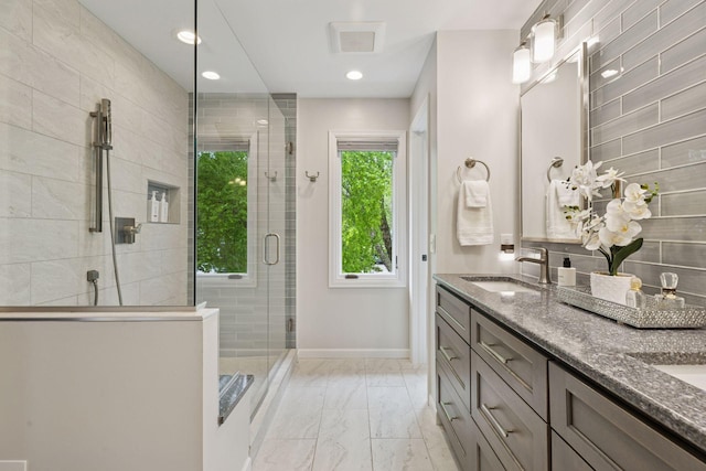 5921 Creek Pt, Minnetonka, MN 55345 - bathroom featuring double vanity, a shower stall, marble finish floors, baseboards, and recessed lighting