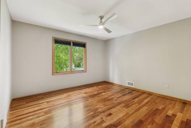 5921 Creek Pt, Minnetonka, MN 55345 - unfurnished room featuring a ceiling fan, wood finished floors, and baseboards