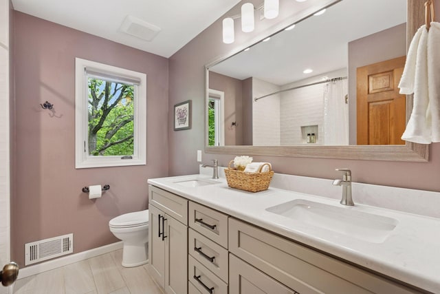 5921 Creek Pt, Minnetonka, MN 55345 - full bathroom with toilet, double vanity, baseboards, and a shower with curtain