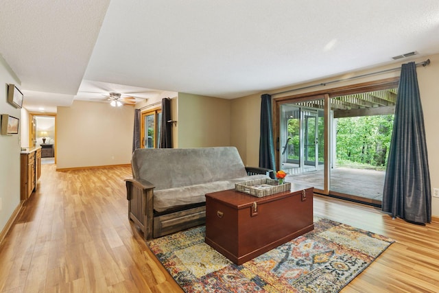 5921 Creek Pt, Minnetonka, MN 55345 - living room featuring light wood-style floors, baseboards, and a ceiling fan