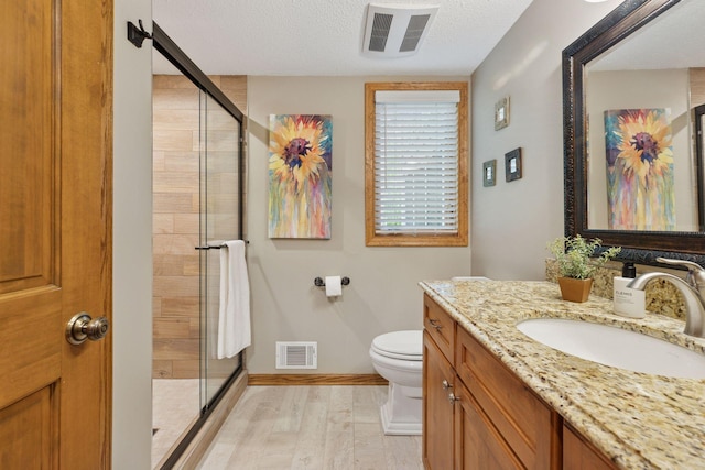5921 Creek Pt, Minnetonka, MN 55345 - full bath featuring vanity, wood finished floors, a shower stall, toilet, and baseboards