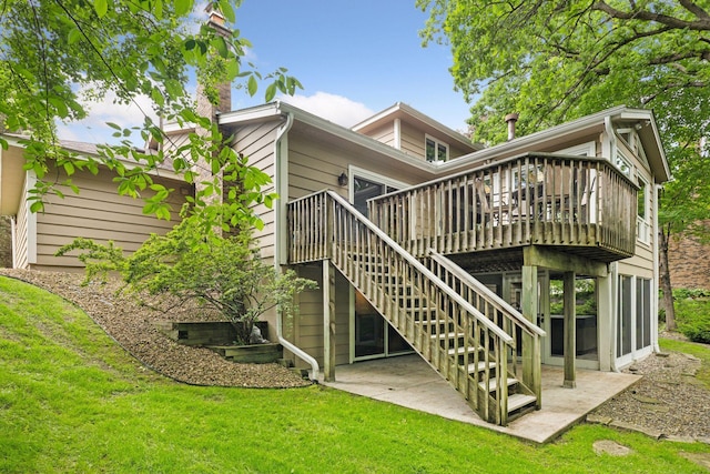 5921 Creek Pt, Minnetonka, MN 55345 - rear view of house featuring a patio, a deck, a chimney, a lawn, and stairs