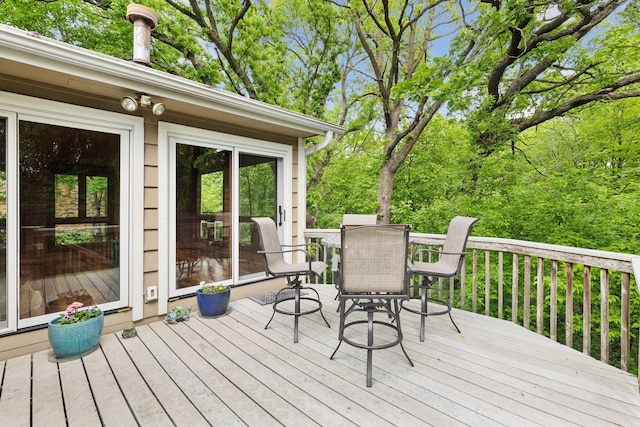5921 Creek Pt, Minnetonka, MN 55345 - wooden deck with outdoor dining area