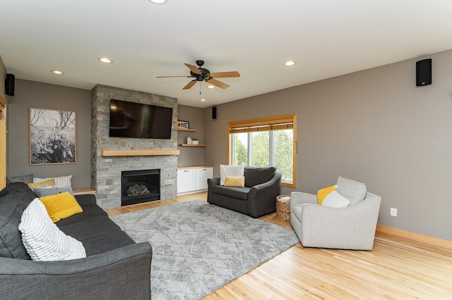 2292 Teakwood Ln SW, Rochester, MN 55902 - living room with wood finished floors, a ceiling fan, recessed lighting, and a fireplace