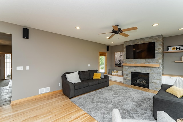2292 Teakwood Ln SW, Rochester, MN 55902 - living area featuring ceiling fan, a stone fireplace, wood finished floors, baseboards, and recessed lighting