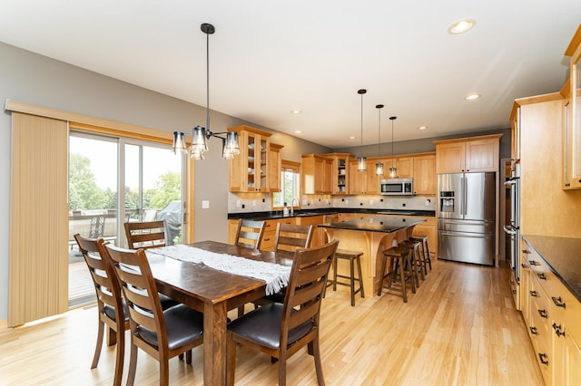2292 Teakwood Ln SW, Rochester, MN 55902 - dining area featuring light wood-type flooring, recessed lighting, and a chandelier