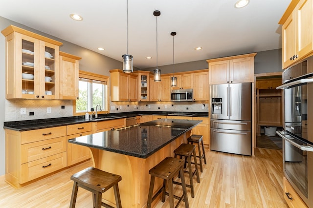 2292 Teakwood Ln SW, Rochester, MN 55902 - kitchen with appliances with stainless steel finishes, a sink, light brown cabinetry, light wood-style floors, and recessed lighting