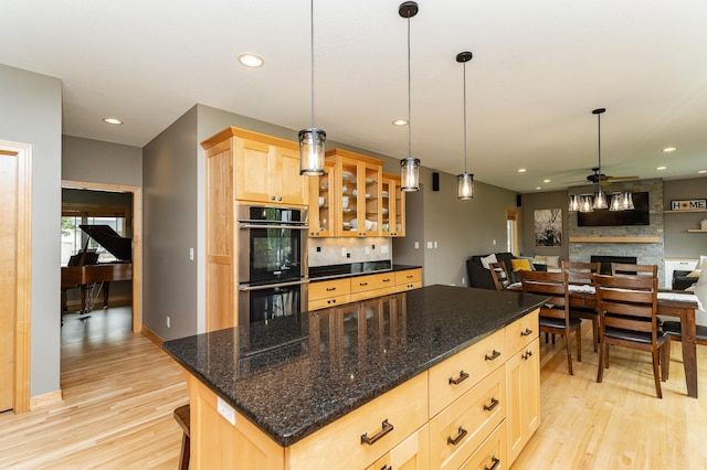 2292 Teakwood Ln SW, Rochester, MN 55902 - kitchen featuring double oven, light brown cabinets, decorative backsplash, light wood-type flooring, and ceiling fan