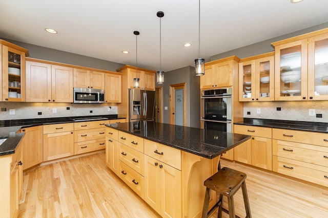 2292 Teakwood Ln SW, Rochester, MN 55902 - kitchen with stainless steel appliances, light brown cabinetry, light wood finished floors, tasteful backsplash, and recessed lighting
